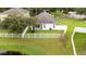 Backyard aerial view featuring well-maintained lawn and charming patio area for outdoor enjoyment at 18150 Leamington Ln, Land O Lakes, FL 34638