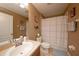Comfortable bathroom featuring soft lighting, vanity, and tub with shower at 18150 Leamington Ln, Land O Lakes, FL 34638