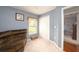 Bedroom featuring plush chair and closet space at 18150 Leamington Ln, Land O Lakes, FL 34638
