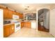 Kitchen with sleek countertops, tile flooring, and white appliances at 18150 Leamington Ln, Land O Lakes, FL 34638