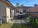 Backyard with patio and outdoor dining set, perfect for entertaining guests and enjoying the outdoors at 204 Shore W Dr, Oldsmar, FL 34677