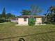 The lawn with some green privacy plants at 204 Shore W Dr, Oldsmar, FL 34677