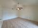 Bedroom featuring tile flooring, ceiling fan, and closet at 204 Shore W Dr, Oldsmar, FL 34677