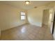 Bedroom featuring neutral paint, tile flooring, and bright natural light at 204 Shore W Dr, Oldsmar, FL 34677