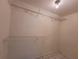 Walk-in closet featuring wire shelving and tile floors at 204 Shore W Dr, Oldsmar, FL 34677