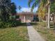 Charming one-story home framed by lush landscaping at 204 Shore W Dr, Oldsmar, FL 34677