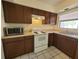 Kitchen featuring updated appliances and ample countertop space at 204 Shore W Dr, Oldsmar, FL 34677