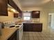 Functional kitchen with stove, tiled floor, and plenty of cabinet space at 204 Shore W Dr, Oldsmar, FL 34677