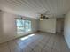 Bright living room with tile flooring, ceiling fan and natural light at 204 Shore W Dr, Oldsmar, FL 34677
