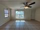 Bright living room with tile flooring, ceiling fan and natural light at 204 Shore W Dr, Oldsmar, FL 34677