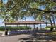 Large picnic shelter with tables and water view, providing a perfect spot for outdoor gatherings at 204 Shore W Dr, Oldsmar, FL 34677