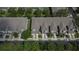 Aerial shot showcasing the neatly arranged townhomes with attached garages and well-maintained streets at 2119 Kings Palace Dr, Riverview, FL 33578