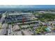 An aerial view displays the property within a community featuring townhomes and a community pool at 2119 Kings Palace Dr, Riverview, FL 33578