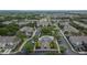 Aerial view of the Villa Serena community showcasing pool, manicured grounds and proximity to a tranquil lake at 2119 Kings Palace Dr, Riverview, FL 33578