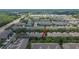 An aerial view showcases townhomes in a community near shopping and thoroughfares at 2119 Kings Palace Dr, Riverview, FL 33578