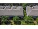The aerial view captures a well-kept lawn alongside a townhome with a screened porch at 2119 Kings Palace Dr, Riverview, FL 33578