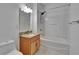 Bathroom features a granite vanity and shower-tub combo at 2119 Kings Palace Dr, Riverview, FL 33578