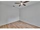 This bedroom offers wood-look floors and a ceiling fan at 2119 Kings Palace Dr, Riverview, FL 33578