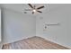 Bedroom featuring a ceiling fan, wood-look flooring, and a white closet door at 2119 Kings Palace Dr, Riverview, FL 33578
