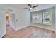 Bedroom with wood-look flooring and a window at 2119 Kings Palace Dr, Riverview, FL 33578