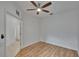 This bedroom features wood-look floors and a ceiling fan at 2119 Kings Palace Dr, Riverview, FL 33578