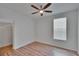 Bedroom featuring wood-look flooring, ceiling fan, and a window at 2119 Kings Palace Dr, Riverview, FL 33578