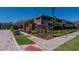 Welcoming Villa Serena community entrance with brick signage and lush landscaping on a bright, sunny day at 2119 Kings Palace Dr, Riverview, FL 33578