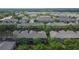 An aerial view shows the screened-in porches in a community of townhomes at 2119 Kings Palace Dr, Riverview, FL 33578