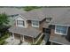 Exterior aerial view of townhomes featuring garages, red shutters, and neat landscaping at 2119 Kings Palace Dr, Riverview, FL 33578