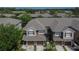 Aerial view of townhomes with garages and well-manicured landscaping in a suburban neighborhood at 2119 Kings Palace Dr, Riverview, FL 33578