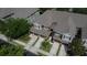 Aerial view of townhomes with garages and well-manicured landscaping in a suburban neighborhood at 2119 Kings Palace Dr, Riverview, FL 33578