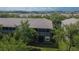 An aerial view shows a screened-in porch surrounded by greenery and trees at 2119 Kings Palace Dr, Riverview, FL 33578