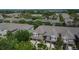 Aerial view of townhomes with garages and well-manicured landscaping in a suburban neighborhood at 2119 Kings Palace Dr, Riverview, FL 33578
