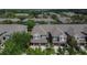 Aerial view of townhomes with garages and well-manicured landscaping in a suburban neighborhood at 2119 Kings Palace Dr, Riverview, FL 33578
