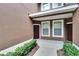 A view of the home's exterior with a solid front door and surrounding landscaping at 2119 Kings Palace Dr, Riverview, FL 33578