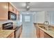 Bright eat-in kitchen area with modern black appliances, granite counters, and open space at 2119 Kings Palace Dr, Riverview, FL 33578
