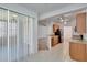 Bright kitchen with stainless steel appliances, tile floors, and an adjacent living room at 2119 Kings Palace Dr, Riverview, FL 33578