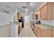 Modern kitchen featuring stainless steel appliances, tile flooring, and granite countertops at 2119 Kings Palace Dr, Riverview, FL 33578
