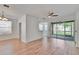 Inviting living room with wood floors, fan, and sliding doors to the patio at 2119 Kings Palace Dr, Riverview, FL 33578
