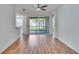 Spacious living room with wood-look flooring and access to outdoor patio at 2119 Kings Palace Dr, Riverview, FL 33578