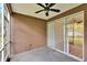 Enclosed patio with ceiling fan and sliding doors at 2119 Kings Palace Dr, Riverview, FL 33578