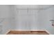 Empty walk-in closet with wood floor and wire shelving at 2119 Kings Palace Dr, Riverview, FL 33578
