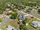 Scenic aerial view of the neighborhood with beautiful landscaping at 2449 Running Oak Ct, Spring Hill, FL 34608