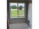 Bright, tiled bathroom with a window view and a shower/tub combo for the ultimate relaxation at 2449 Running Oak Ct, Spring Hill, FL 34608