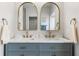 Bathroom featuring double sinks, modern fixtures, gold hardware, and a light grey vanity at 2449 Running Oak Ct, Spring Hill, FL 34608