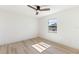 Well-lit bedroom with sleek wood-look flooring and a new window at 2449 Running Oak Ct, Spring Hill, FL 34608