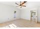 Bright bedroom with tile flooring and an open doorway at 2449 Running Oak Ct, Spring Hill, FL 34608