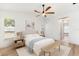 Bright bedroom with ceiling fan, a neutral color scheme, and direct access to the hallway at 2449 Running Oak Ct, Spring Hill, FL 34608