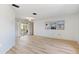 Inviting living room featuring natural light, neutral decor, and access to the pool area at 2449 Running Oak Ct, Spring Hill, FL 34608