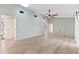 Spacious living room with high ceilings and lots of natural light filtering through multiple entry points at 2449 Running Oak Ct, Spring Hill, FL 34608